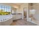 Main bathroom features a large soaking tub and walk-in shower at 13699 Pecos Loop, Broomfield, CO 80023