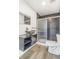Bathroom featuring hexagon tile in the shower and vessel sink on modern vanity at 801 S Leyden St, Denver, CO 80224