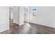 Bedroom featuring mirrored closet doors and wood look flooring at 801 S Leyden St, Denver, CO 80224