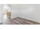 Bedroom with modern wood look flooring and a view of the hallway at 801 S Leyden St, Denver, CO 80224