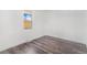 Bright bedroom with modern wood look flooring and a large window at 801 S Leyden St, Denver, CO 80224