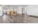 Open-concept living area showcasing wood floors, modern design elements, and seamless transitions to the kitchen at 801 S Leyden St, Denver, CO 80224