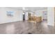 Bright living room featuring a staircase with wood railing, hardwood floors, and a modern interior design at 801 S Leyden St, Denver, CO 80224