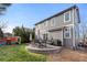 Home's backyard with patio, grill and playset at 3087 Black Canyon Way, Castle Rock, CO 80109