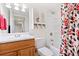 Bathroom with wood vanity, toilet and bathtub shower at 3087 Black Canyon Way, Castle Rock, CO 80109