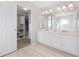 Bathroom with double vanity and walk-in closet at 3087 Black Canyon Way, Castle Rock, CO 80109