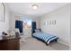 Bedroom with twin bed, rocking chair, and window at 3087 Black Canyon Way, Castle Rock, CO 80109