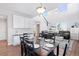 Dining area with hardwood floors and view into living room and kitchen at 3087 Black Canyon Way, Castle Rock, CO 80109