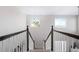 Elegant staircase with dark wood railings and chandelier at 3087 Black Canyon Way, Castle Rock, CO 80109