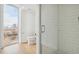 Modern bathroom with a large shower and window at 3575 Chestnut Pl # 406, Denver, CO 80216