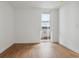 Bright bedroom with wood floors and a window at 3575 Chestnut Pl # 406, Denver, CO 80216