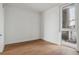 Bright bedroom with wood floors and large window at 3575 Chestnut Pl # 406, Denver, CO 80216