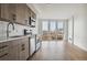 Modern kitchen with stainless steel appliances and wood cabinets at 3575 Chestnut Pl # 406, Denver, CO 80216