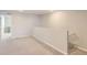 Open hallway with neutral carpet, leading to other rooms, offering potential living space at 1353 Reynolds St # 2B, Fort Lupton, CO 80621