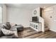 Bright living room with stylish vinyl flooring, a gray sectional and adjacent stairway at 1353 Reynolds St # 2B, Fort Lupton, CO 80621