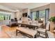 Open dining room area with access to an office, decorative curtains, hardwood floors, and a neutral color palette at 9424 Ridgeline Blvd # I, Highlands Ranch, CO 80129