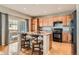 Well-equipped kitchen features an island with seating, modern appliances, and ample cabinet space at 9424 Ridgeline Blvd # I, Highlands Ranch, CO 80129