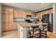 Spacious kitchen features an island with seating, stainless steel appliances, and abundant cabinetry at 9424 Ridgeline Blvd # I, Highlands Ranch, CO 80129
