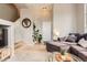 Cozy living room showcases a sectional sofa, stylish coffee table, and easy access to staircase at 9424 Ridgeline Blvd # I, Highlands Ranch, CO 80129