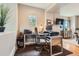 Office with gray walls, hardwood floors, a large window, and a built-in desk with office equipment at 9424 Ridgeline Blvd # I, Highlands Ranch, CO 80129