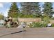 Inviting Civic Green Park entrance with stone waterfall feature and lush greenery at 9424 Ridgeline Blvd # I, Highlands Ranch, CO 80129