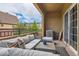 Inviting balcony featuring cozy seating area with scenic neighborhood outlook at 9424 Ridgeline Blvd # I, Highlands Ranch, CO 80129