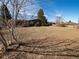 An ample backyard with a view of the home and blue skies at 1501 E Caley Ave, Centennial, CO 80121