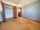 Bedroom featuring blue accent wall and closet, presenting an opportunity for customization and modern decor at 1501 E Caley Ave, Centennial, CO 80121