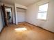 Bedroom featuring natural light from a window and a closet, presenting an opportunity for customization at 1501 E Caley Ave, Centennial, CO 80121