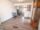 Spacious living room with updated wood floors, fireplace, and open view of staircase at 1501 E Caley Ave, Centennial, CO 80121