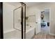 Bright bathroom featuring a tub and shower combo with white subway tiles at 17761 E 95Th Pl, Commerce City, CO 80022