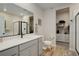 Modern bathroom featuring a white vanity, toilet, and an open closet at 17761 E 95Th Pl, Commerce City, CO 80022