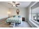 Inviting bedroom featuring a ceiling fan and a cozy window seat at 17761 E 95Th Pl, Commerce City, CO 80022