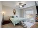 Cozy bedroom featuring a ceiling fan, carpet and window for lots of natural light at 17761 E 95Th Pl, Commerce City, CO 80022