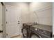 Functional laundry room featuring a washer and dryer and ample storage at 17761 E 95Th Pl, Commerce City, CO 80022