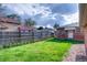 Expansive backyard with green lawn, privacy fence, and potential for outdoor enjoyment at 2028 Perry St, Denver, CO 80212