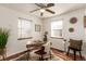 Bright home office with hardwood floors, desk, and abundant natural light at 2028 Perry St, Denver, CO 80212