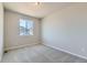 Simple bedroom with neutral carpeting and a window at 5991 Sawdust Dr, Brighton, CO 80601