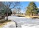 Landscaped community with a frozen pond and mountain views at 6397 Deframe Way, Arvada, CO 80004