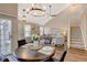 Open dining area with a view of the living room and kitchen at 6397 Deframe Way, Arvada, CO 80004