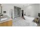 Spacious bathroom features a glass shower, soaking tub, and dual sink vanity at 200 Magnolia St, Denver, CO 80220