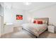 Bright bedroom featuring a queen bed, neutral color palette, and a modern art piece at 200 Magnolia St, Denver, CO 80220