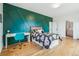 Bedroom with a feature wall, desk area, and ensuite bathroom at 200 Magnolia St, Denver, CO 80220