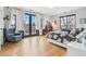 Bedroom with outdoor patio access, cozy sitting area, and generous natural light at 200 Magnolia St, Denver, CO 80220