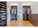 Walk-in closet with custom shelving and clothing racks for optimal storage at 200 Magnolia St, Denver, CO 80220