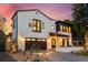 Beautiful exterior elevation with a two car garage and manicured landscaping at 200 Magnolia St, Denver, CO 80220