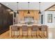 Modern kitchen with a large island, quartz countertops, and bar stool seating at 200 Magnolia St, Denver, CO 80220