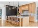 Modern kitchen features a large island with seating, marble countertops, and sleek, two-tone cabinetry at 200 Magnolia St, Denver, CO 80220