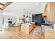 Modern kitchen with a large island, stainless steel appliances, and hardwood floors at 200 Magnolia St, Denver, CO 80220