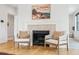 Living room features a modern fireplace, mantle art, and stylish seating at 200 Magnolia St, Denver, CO 80220